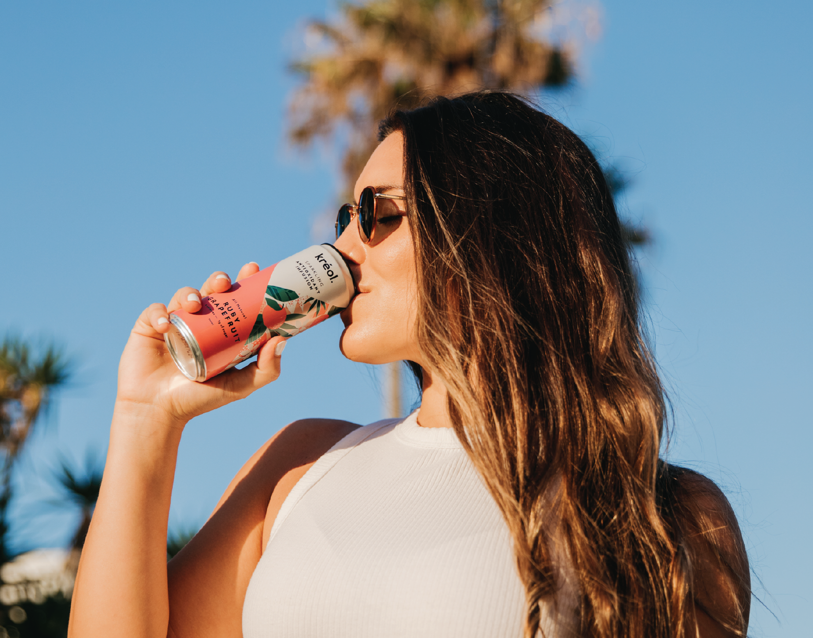 lady drinking kreol ruby grapefruit drink